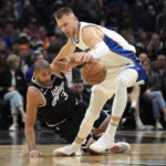 
              Washington Wizards center Kristaps Porzingis, right, steals the ball from Los Angeles Clippers forward Nicolas Batum during the second half of an NBA basketball game Saturday, Dec. 17, 2022, in Los Angeles. (AP Photo/Marcio Jose Sanchez)
            