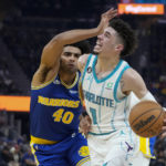 
              Charlotte Hornets guard LaMelo Ball (1) is fouled by Golden State Warriors forward Anthony Lamb during the first half of an NBA basketball game in San Francisco, Tuesday, Dec. 27, 2022. (AP Photo/Godofredo A. Vásquez)
            