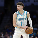 
              Charlotte Hornets guard LaMelo Ball runs the offense against the Detroit Pistons during the first half of an NBA basketball game in Charlotte, N.C., Wednesday, Dec. 14, 2022. (AP Photo/Nell Redmond)
            