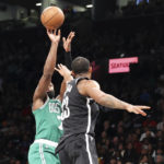 
              Boston Celtics guard Jaylen Brown shoots against Brooklyn Nets forward Nic Claxton during the first half of an NBA basketball game, Sunday, Dec. 4, 2022, in New York. (AP Photo/Jessie Alcheh)
            