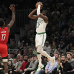 
              Boston Celtics guard Jaylen Brown (7) takes a 3-point shot over Houston Rockets forward Tari Eason (17) during the second half of an NBA basketball game, Tuesday, Dec. 27, 2022, in Boston. (AP Photo/Charles Krupa)
            