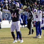 
              Chicago Bears linebacker Matthew Adams (44) celebrates as Buffalo Bills kicker Tyler Bass (2) misses a field goal in the first half of an NFL football game in Chicago, Saturday, Dec. 24, 2022. (AP Photo/Nam Y. Huh)
            