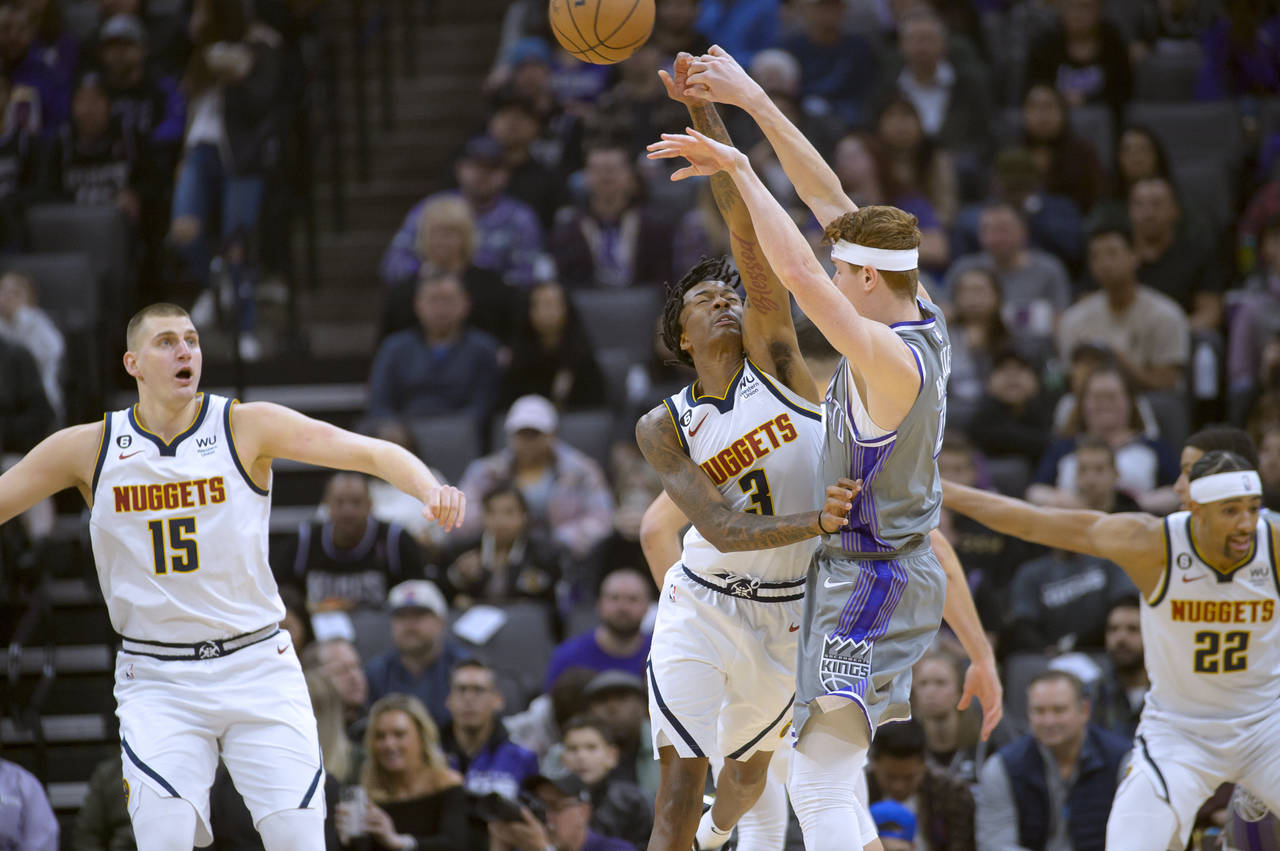 Denver Nuggets guard Bones Hyland (3) guards Sacramento Kings guard Kevin Huerter during the first ...