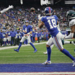 
              New York Giants quarterback Daniel Jones (8) completes a pass to wide receiver Isaiah Hodgins (18) for a touchdown against the Philadelphia Eagles during the second quarter of an NFL football game, Sunday, Dec. 11, 2022, in East Rutherford, N.J. (AP Photo/Bryan Woolston)
            