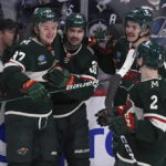 
              Minnesota Wild's Mats Zuccarello celebrates his goal against the Winnipeg Jets with Kirill Kaprizov, Sam Steel (13) and Calen Addison (2) during the first period of an NHL hockey game in Winnipeg, Manitoba, on Tuesday Dec. 27, 2022. (Fred Greenslade/The Canadian Press via AP)
            