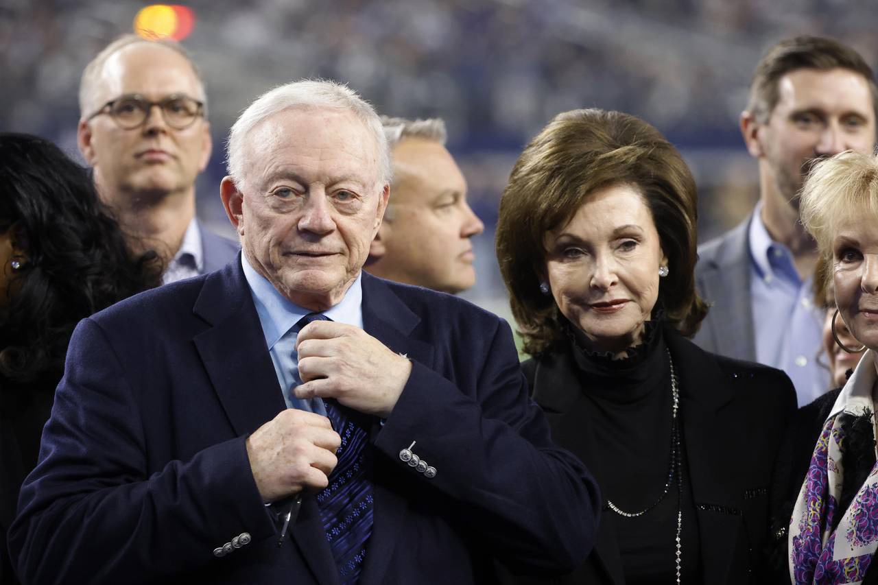 FILE -Dallas Cowboys owner Jerry Jones and his wife Gene Jones, right, on the field during an NFL F...