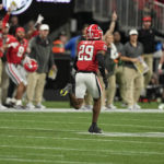 
              Georgia defensive back Christopher Smith II (29) runs in for touchdown after a blocked LSU field goal attempt in the first half of the Southeastern Conference championship NCAA college football game, Saturday, Dec. 3, 2022, in Atlanta. (AP Photo/Brynn Anderson)
            