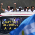 
              Coach Lionel Scaloni waves during a homecoming parade for the Argentine soccer team that won the World Cup tournament in Buenos Aires, Argentina, Tuesday, Dec. 20, 2022. (AP Photo/Natacha Pisarenko)
            