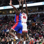 
              Chicago Bulls forward Patrick Williams, right, shoots over Detroit Pistons center Isaiah Stewart during the first half of an NBA basketball game in Chicago, Friday, Dec. 30, 2022. (AP Photo/Nam Y. Huh)
            