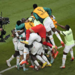 
              Senegal players celebrate after teammate Kalidou Koulibaly scored their side's second goal during the World Cup group A soccer match between Ecuador and Senegal, at the Khalifa International Stadium in Doha, Qatar, Tuesday, Nov. 29, 2022. (AP Photo/Aijaz Rahi)
            