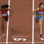 
              FILE - Russia's Natalya Antyukh, right, powers ahead of United States' Lashinda Demus to win gold in the women's 400-meter hurdles final during the athletics in the Olympic Stadium at the 2012 Summer Olympics in London, Wednesday, Aug. 8, 2012. Russian 400-meter hurdler Natalya Antyukh will lose her gold medal from the 2012 London Games due to doping, putting American Lashinda Demus in position to be named the champion more than a decade after the race. (AP Photo/Daniel Ochoa De Olza, File)
            
