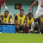 
              Portugal's Cristiano Ronaldo, third from right, sits on the bench during the World Cup round of 16 soccer match between Portugal and Switzerland, at the Lusail Stadium in Lusail, Qatar, Tuesday, Dec. 6, 2022. (AP Photo/Alessandra Tarantino)
            