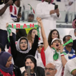 
              FILE - Iranian women soccer fans cheer during the World Cup group B soccer match between Iran and the United States at the Al Thumama Stadium in Doha, Qatar, Tuesday, Nov. 29, 2022. (AP Photo/Ashley Landis, File)
            
