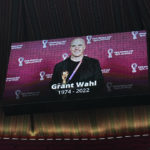 
              A tribute to journalist Grant Wahl is shown on a screen before the World Cup quarterfinal soccer match between England and France, at the Al Bayt Stadium in Al Khor, Qatar, Saturday, Dec. 10, 2022. Wahl, one of the most well-known soccer writers in the United States, died early Saturday Dec. 10, 2022 while covering the World Cup match between Argentina and the Netherlands. (AP Photo/Abbie Parr)
            