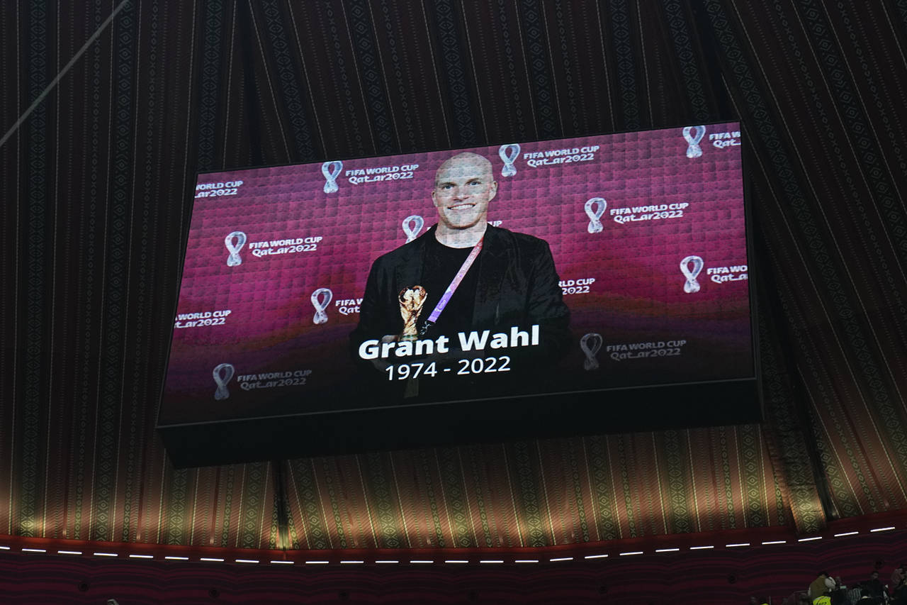 A tribute to journalist Grant Wahl is shown on a screen before the World Cup quarterfinal soccer ma...