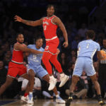 
              Ohio State forward Brice Sensabaugh (10) jumps while guarding North Carolina forward Leaky Black (1) during the first half of an NCAA college basketball game in the CBS Sports Classic, Saturday, Dec. 17, 2022, in New York. (AP Photo/Julia Nikhinson)
            