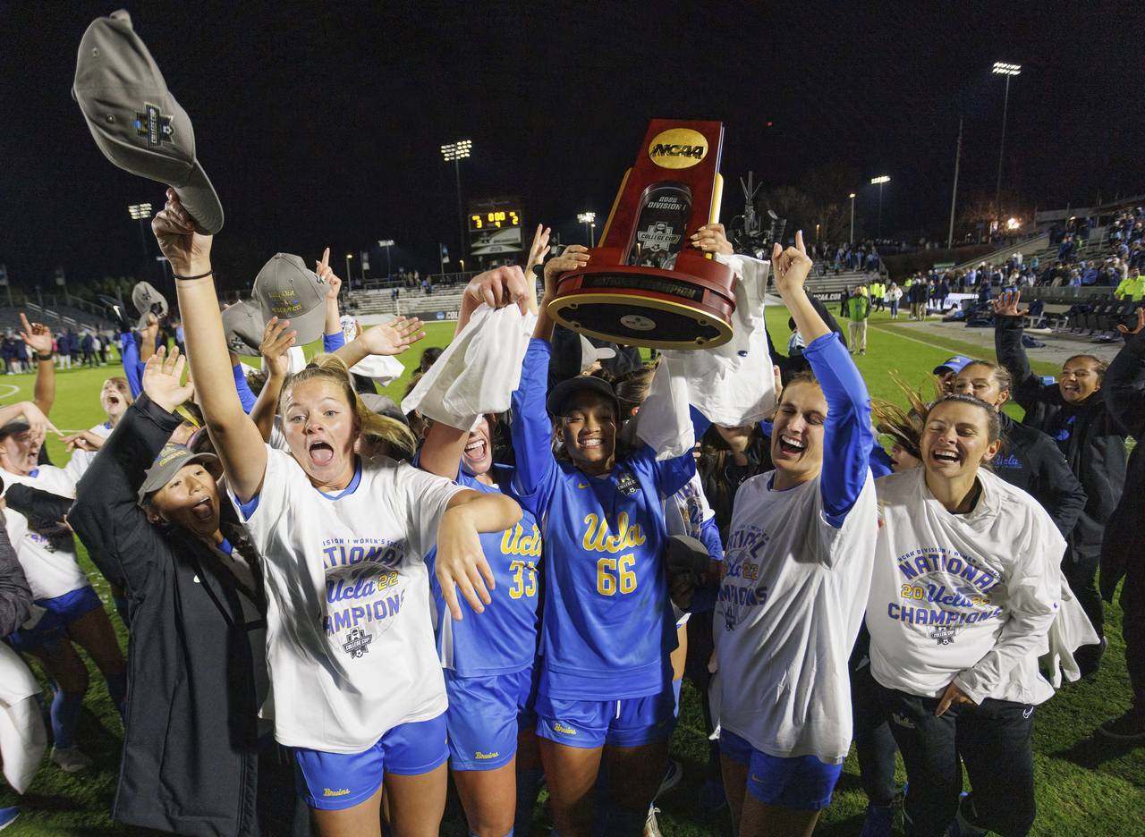UCLA players celebrates after defeating North Carolina to win the NCAA women's soccer tournament fi...