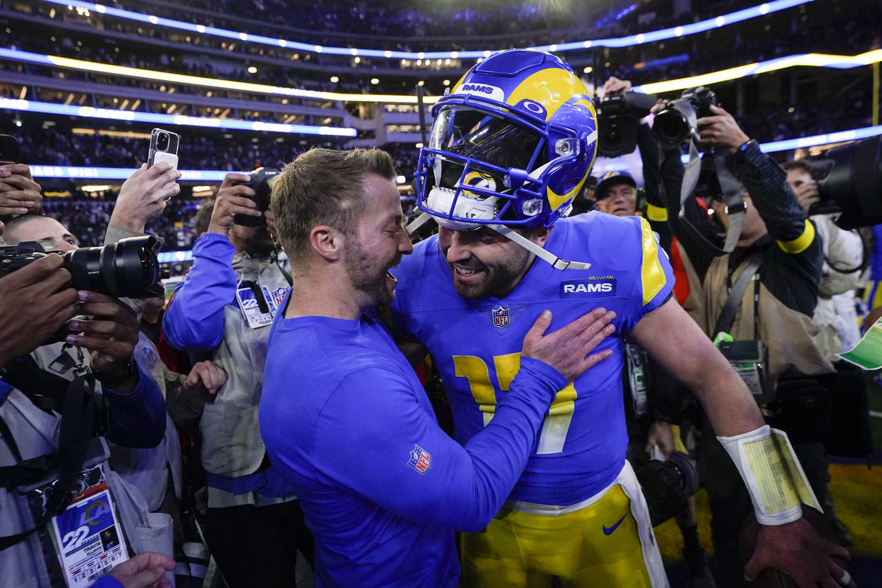 Los Angeles Rams head coach Sean McVay, left, embraces quarterback Baker Mayfield after the Rams de...