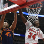 
              New York Knicks' Jerico Sims (45) has his shot blocked by Chicago Bulls' Javonte Green (24) during the first half of an NBA basketball game Friday, Dec. 16, 2022, in Chicago. (AP Photo/Paul Beaty)
            