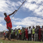 
              A Maasai man throws a javelin as he competes in the Maasai Olympics in Kimana Sanctuary, southern Kenya Saturday, Dec. 10, 2022. The sports event, first held in 2012, consists of six track-and-field events based on traditional warrior skills and was created as an alternative to lion-killing as a rite of passage. (AP Photo/Brian Inganga)
            