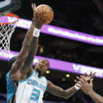 
              Charlotte Hornets guard Terry Rozier (3) drives to the basket against the Detroit Pistons during the first half of an NBA basketball game in Charlotte, N.C., Wednesday, Dec. 14, 2022. (AP Photo/Nell Redmond)
            