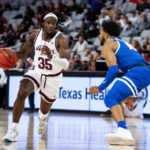 
              Texas A&M guard Manny Obaseki (35) attempts to drive past Boise State guard Marcus Shaver Jr. during the first half of an NCAA college basketball game in Fort Worth, Texas, Saturday, Dec. 3, 2022. (AP Photo/Emil Lippe)
            