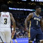 
              New Orleans Pelicans forward Zion Williamson (1) celebrates a basket against Denver Nuggets guard Bones Hyland (3) in the first half of an NBA basketball game in New Orleans, Sunday, Dec. 4, 2022. (AP Photo/Matthew Hinton)
            
