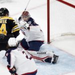 
              Boston Bruins' Jake DeBrusk (74) watches the goal by David Pastrnak get past Columbus Blue Jackets' Daniil Tarasov, right, during the first period of an NHL hockey game, Saturday, Dec. 17, 2022, in Boston. (AP Photo/Michael Dwyer)
            
