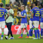 
              Brazil's Neymar, second left, and his teammates after the World Cup group G soccer match between Cameroon and Brazil, at the Lusail Stadium in Lusail, Qatar, Saturday, Dec. 3, 2022. (AP Photo/Moises Castillo)
            