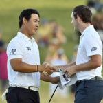 
              FILE - Tom Kim, of South Korea, left, shakes hands with Patrick Cantlay after Kim won the Shriners Children's Open golf tournament, Sunday, Oct. 9, 2022, in Las Vegas. Kim was one of the new personalities on the PGA Tour this year.  (AP Photo/David Becker, File)
            