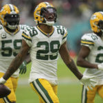
              Green Bay Packers cornerback Rasul Douglas (29) celebrates making an interception, during the second half of an NFL football game against the Miami Dolphins, Sunday, Dec. 25, 2022, in Miami Gardens, Fla. (AP Photo/Jim Rassol)
            