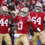 
              San Francisco 49ers quarterback Brock Purdy (13) celebrates with teammates after running for a touchdown against the Tampa Bay Buccaneers during the first half of an NFL football game in Santa Clara, Calif., Sunday, Dec. 11, 2022. (AP Photo/Jed Jacobsohn)
            