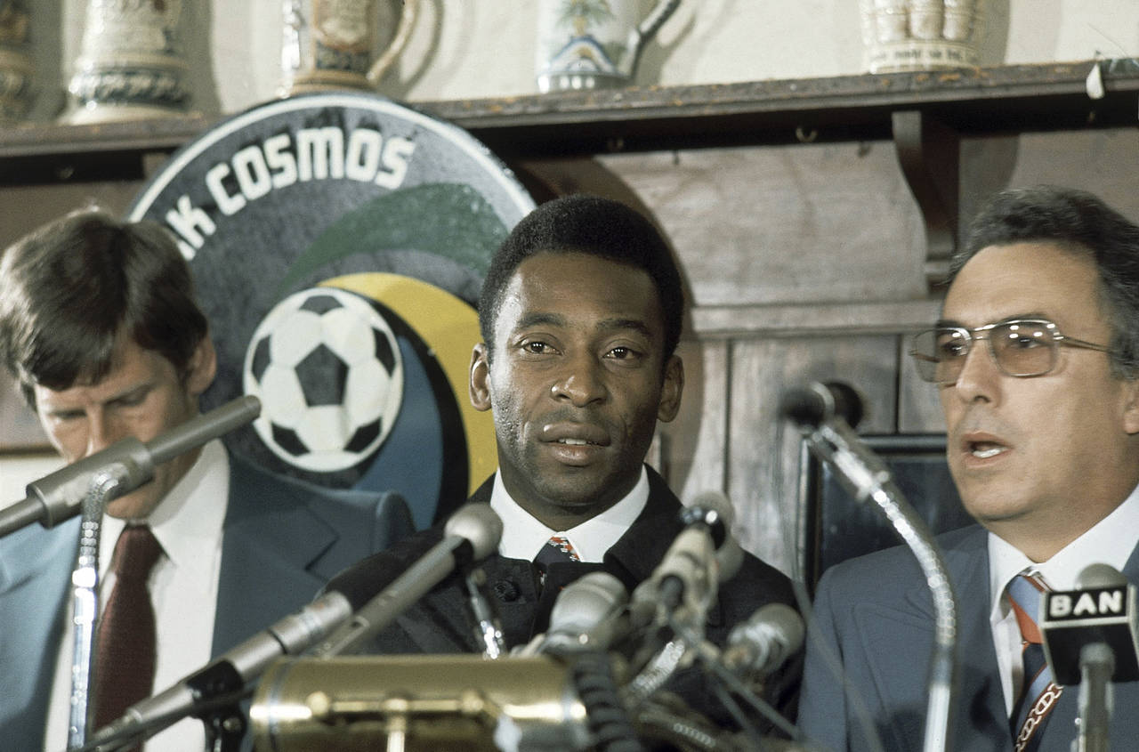 FILE -  New York Cosmos' Pele stands with others at news conference in New York on June 10, 1975. D...