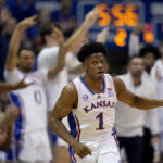 
              Kansas guard Joseph Yesufu (1) celebrates after making a basket during the second half of an NCAA college basketball game against Oklahoma State Saturday, Dec. 31, 2022, in Lawrence, Kan. Kansas won 69-67. (AP Photo/Charlie Riedel)
            