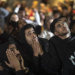 
              Moroccans react while following the penalty shootouts between Morocco and Spain in a World Cup soccer match played in Qatar, in Rabat, Morocco, Tuesday, Dec. 6, 2022. (AP Photo/Mosa'ab Elshamy)
            