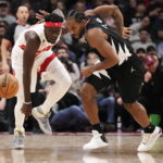 
              Los Angeles Clippers forward Kawhi Leonard, right, steals the ball from Toronto Raptors forward Pascal Siakam during the first half of an NBA basketball game Tuesday, Dec. 27, 2022, in Toronto. (Frank Gunn/The Canadian Press via AP)
            