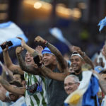
              FILE - Argentina soccer fans cheer before the World Cup group C soccer match between Poland and Argentina at the Stadium 974 in Doha, Qatar, Wednesday, Nov. 30, 2022. (AP Photo/Natacha Pisarenko, File)
            