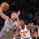 
              Sacramento Kings guard Matthew Dellavedova (8) drives to the basket against New York Knicks guard Immanuel Quickley (5) during the first half of an NBA basketball game, Sunday, Dec. 11, 2022, in New York. (AP Photo/Noah K. Murray)
            