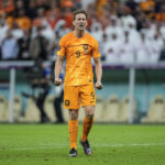 
              Luuk de Jong of the Netherlands celebrates after scoring a penalty kick during the World Cup quarterfinal soccer match between the Netherlands and Argentina, at the Lusail Stadium in Lusail, Qatar, Saturday Dec. 10, 2022. (AP Photo/Jorge Saenz)
            