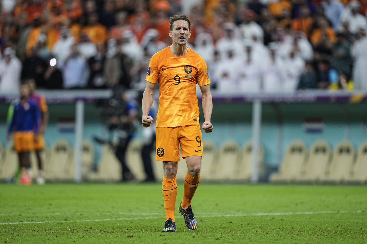 Luuk de Jong of the Netherlands celebrates after scoring a penalty kick during the World Cup quarte...