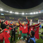 
              Morocco's players celebrate after the World Cup quarterfinal soccer match between Morocco and Portugal, at Al Thumama Stadium in Doha, Qatar, Saturday, Dec. 10, 2022. (AP Photo/Martin Meissner)
            