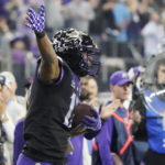 
              TCU wide receiver Quentin Johnston (1) celebrates a catch for a first down in the second half of the Big 12 Conference championship NCAA college football game against Kansas State, Saturday, Dec. 3, 2022, in Arlington, Texas. (AP Photo/LM Otero)
            