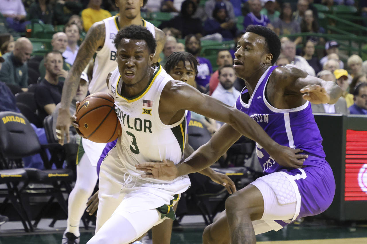 Baylor guard Dale Bonner (3) drives past Tarleton State guard Javontae Hopkins in the first half of...