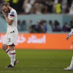 
              Tim Ream of the United States, left, leaves the pitch after the World Cup round of 16 soccer match between the Netherlands and the United States, at the Khalifa International Stadium in Doha, Qatar, Saturday, Dec. 3, 2022. The Netherlands won 3-1. (AP Photo/Martin Meissner)
            