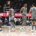 
              West Virginia players celebrate during the first half of an NCAA college basketball game against UAB in Morgantown, W.Va., Saturday, Dec. 10, 2022. (AP Photo/Kathleen Batten)
            