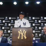 
              New York Yankees' Aaron Judge, center, speaks while owner Hal Steinbrenner, left, and president Randy Levine look on during a baseball news conference at Yankee Stadium, Wednesday, Dec. 21, 2022, in New York. Judge has been appointed captain of the New York Yankees after agreeing to a $360 million, nine-year contract to remain in pinstripes. (AP Photo/Seth Wenig)
            