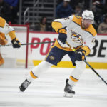 
              Nashville Predators center Yakov Trenin, right, looks to pass the puck as defenseman Kevin Gravel trails the play in the second period of an NHL hockey game against the Colorado Avalanche, Saturday, Dec. 17, 2022, in Denver. (AP Photo/David Zalubowski)
            