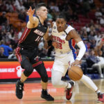 
              Detroit Pistons guard Jaden Ivey (23) drives to the basket as Miami Heat guard Tyler Herro (14) defends during the first half of an NBA basketball game Tuesday, Dec. 6, 2022, in Miami. (AP Photo/Lynne Sladky)
            