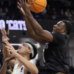 
              Prairie View A&M guard Hegel Augustin, right, rebounds the ball against Northwestern forward Tydus Verhoeven during the second half of an NCAA college basketball game in Evanston, Ill., Sunday, Dec. 11, 2022. Northwestern won 61-51. (AP Photo/Nam Y. Huh)
            