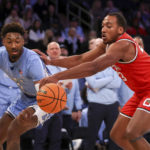 
              North Carolina forward Leaky Black and Ohio State forward Zed Key fight for the ball during the first half of an NCAA college basketball game in the CBS Sports Classic, Saturday, Dec. 17, 2022, in New York. (AP Photo/Julia Nikhinson)
            